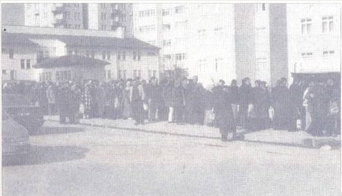 Residents of Ankara in bread line early in the morning. February 2002.